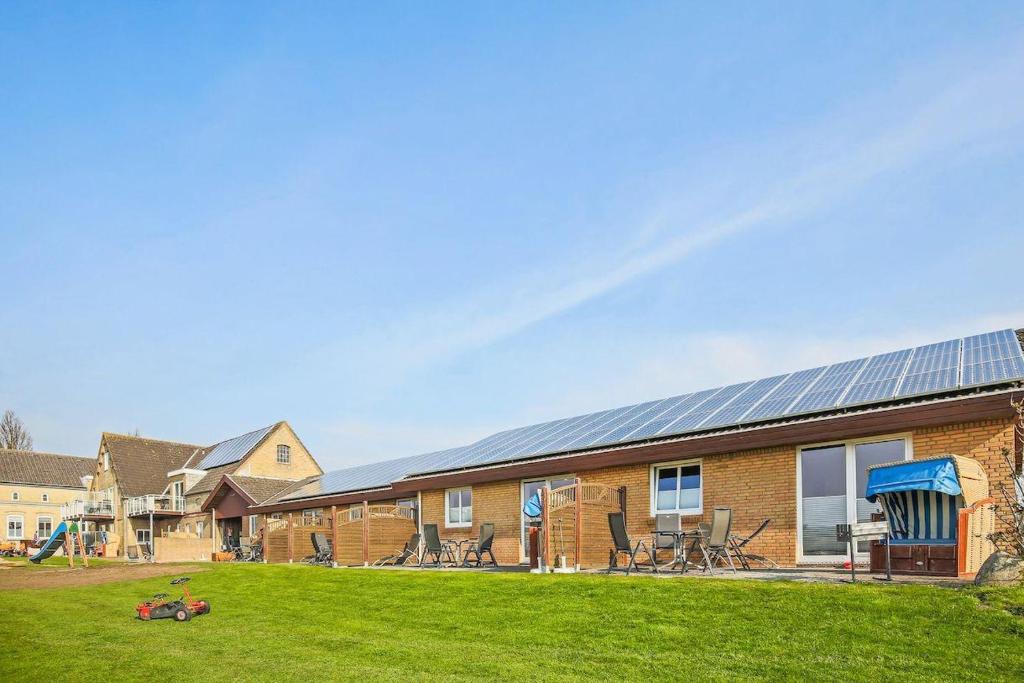 a brick building with solar panels on it at Buedlfarm-Haus in Sahrensdorf