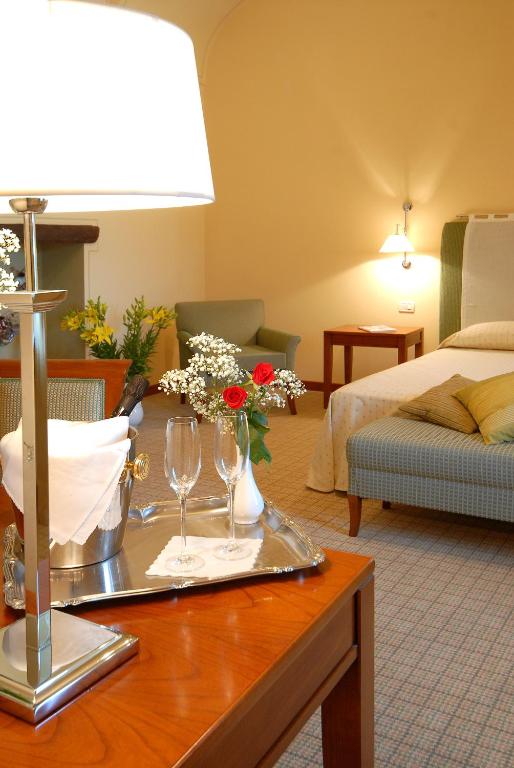 Postel nebo postele na pokoji v ubytování Hotel Antico Podere Propano