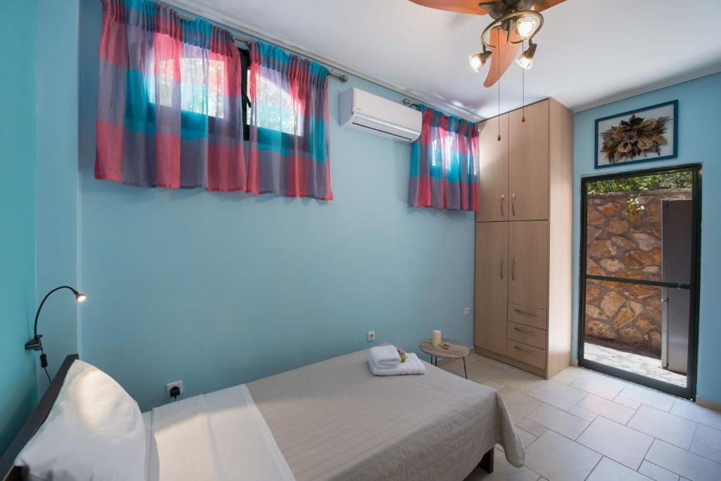Postel nebo postele na pokoji v ubytování Aloe Villa