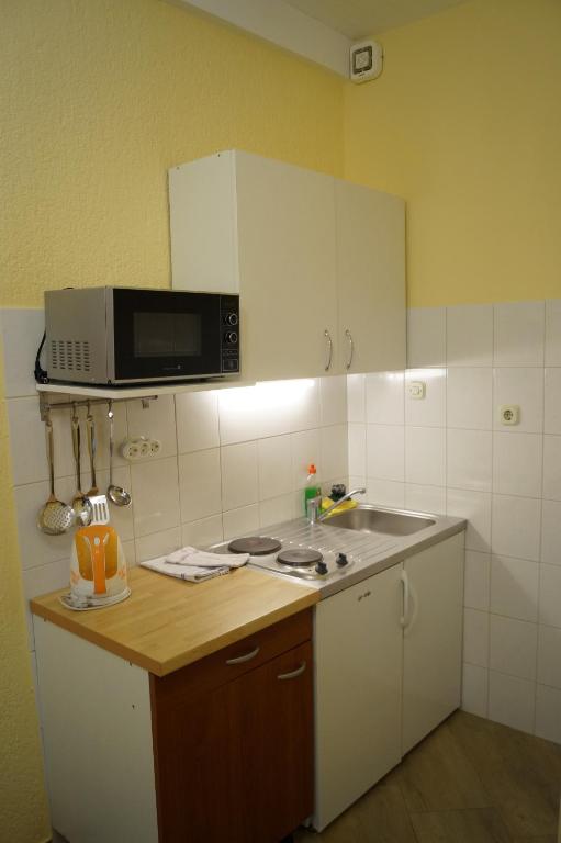 Kuchyň nebo kuchyňský kout v ubytování Apartments Mario with private parking