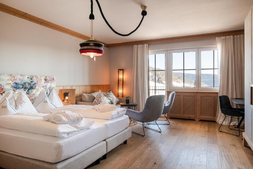 Postel nebo postele na pokoji v ubytování Hotel Hirzer 2781