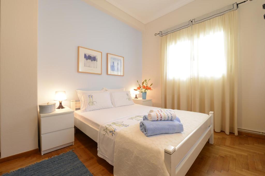 Łóżko lub łóżka w pokoju w obiekcie Daphne Suite