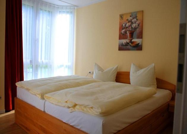 Postel nebo postele na pokoji v ubytování R&R Villen Baabe