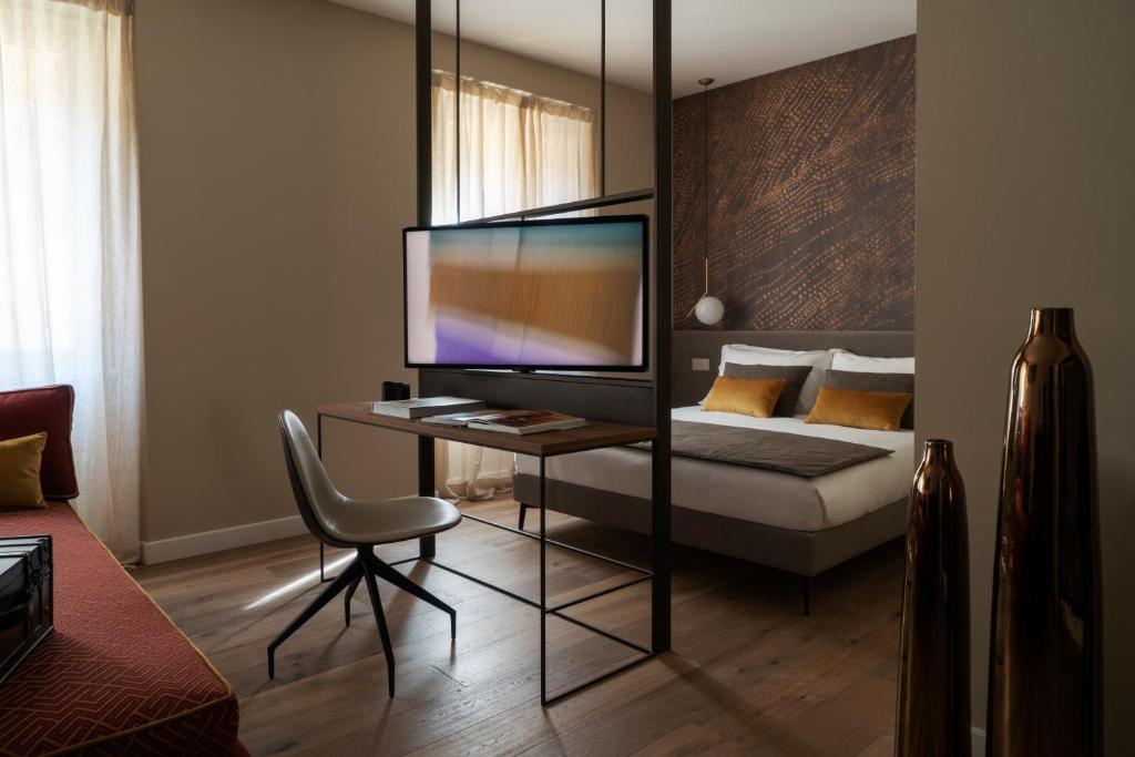 Et tv og/eller underholdning på Della Spiga Suites by Brera Apartments