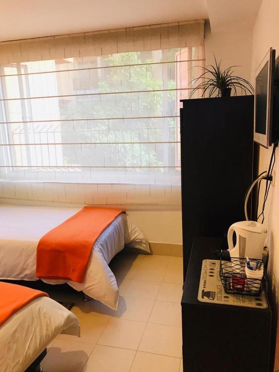 TV a/nebo společenská místnost v ubytování Casa Prada Bed & Breakfast