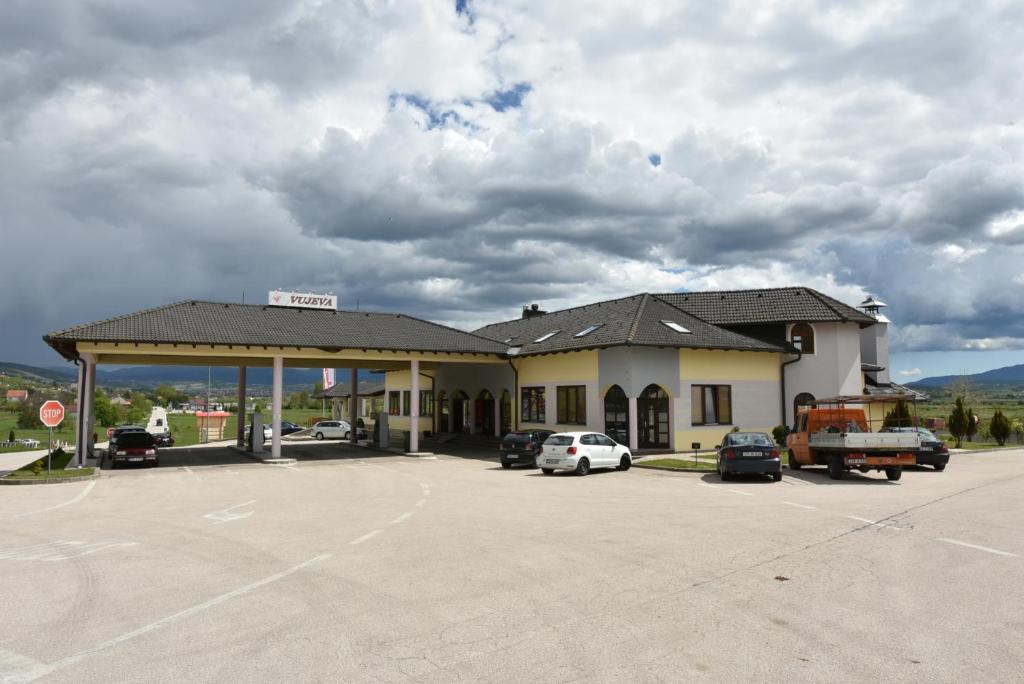 a gas station with cars parked in a parking lot at Motel Vujeva in Livno