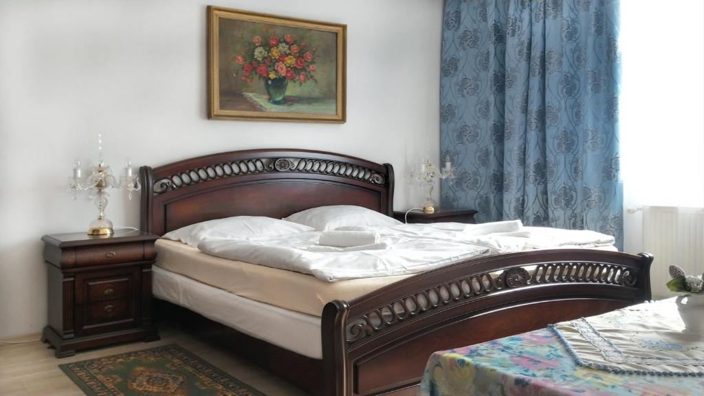 Postel nebo postele na pokoji v ubytování Hotel Garni