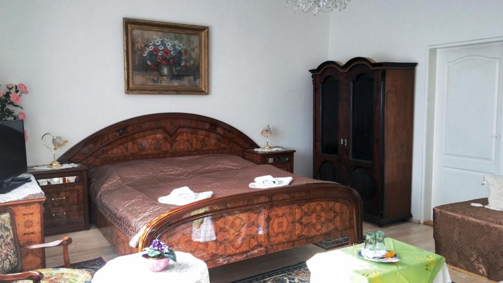 Postel nebo postele na pokoji v ubytování Hotel Garni