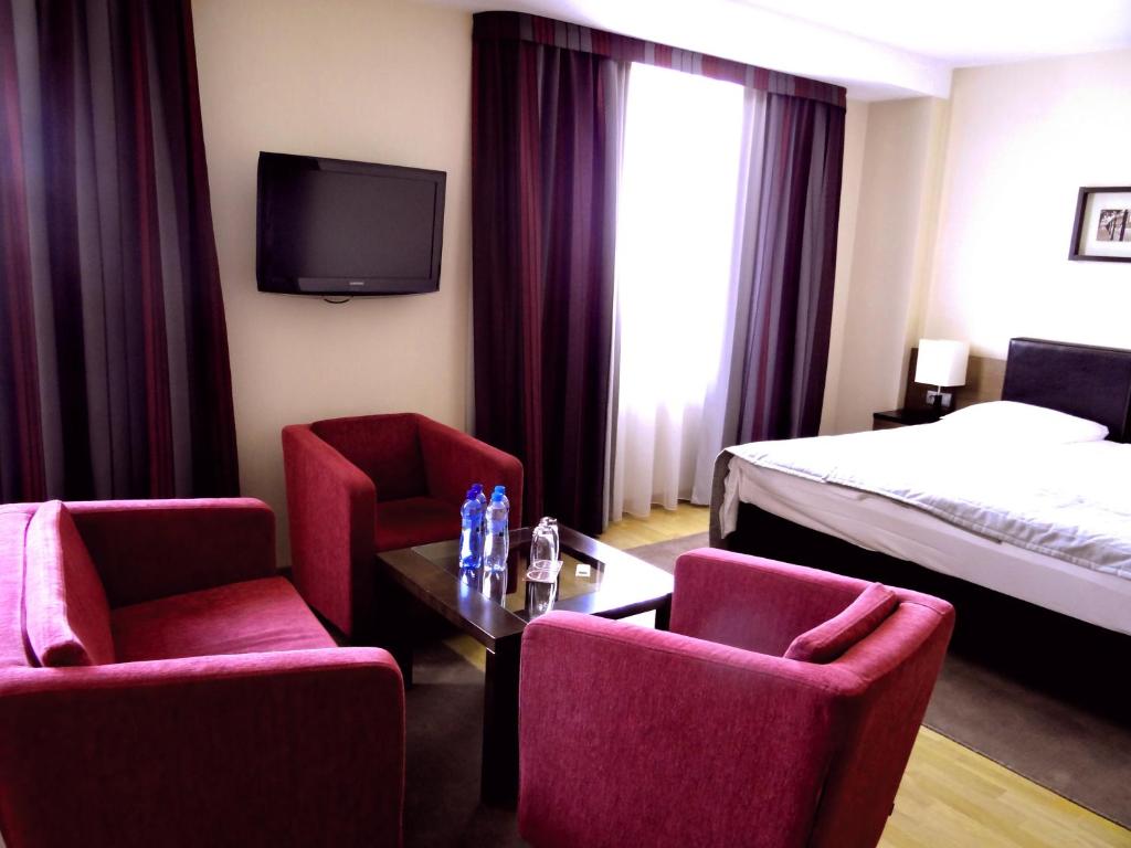 Postel nebo postele na pokoji v ubytování Qubus Hotel Bielsko-Biała
