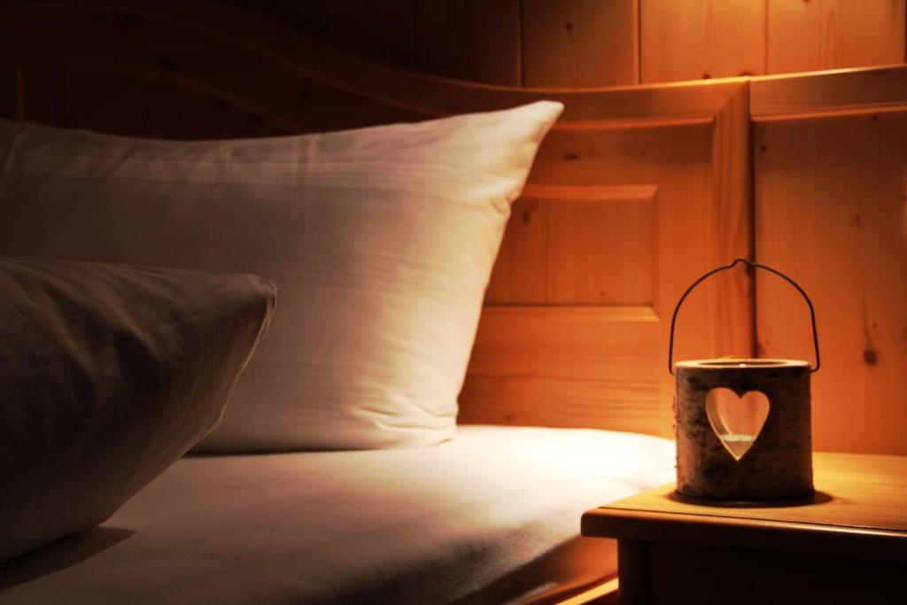 Postel nebo postele na pokoji v ubytování Hotel Garni Alpina