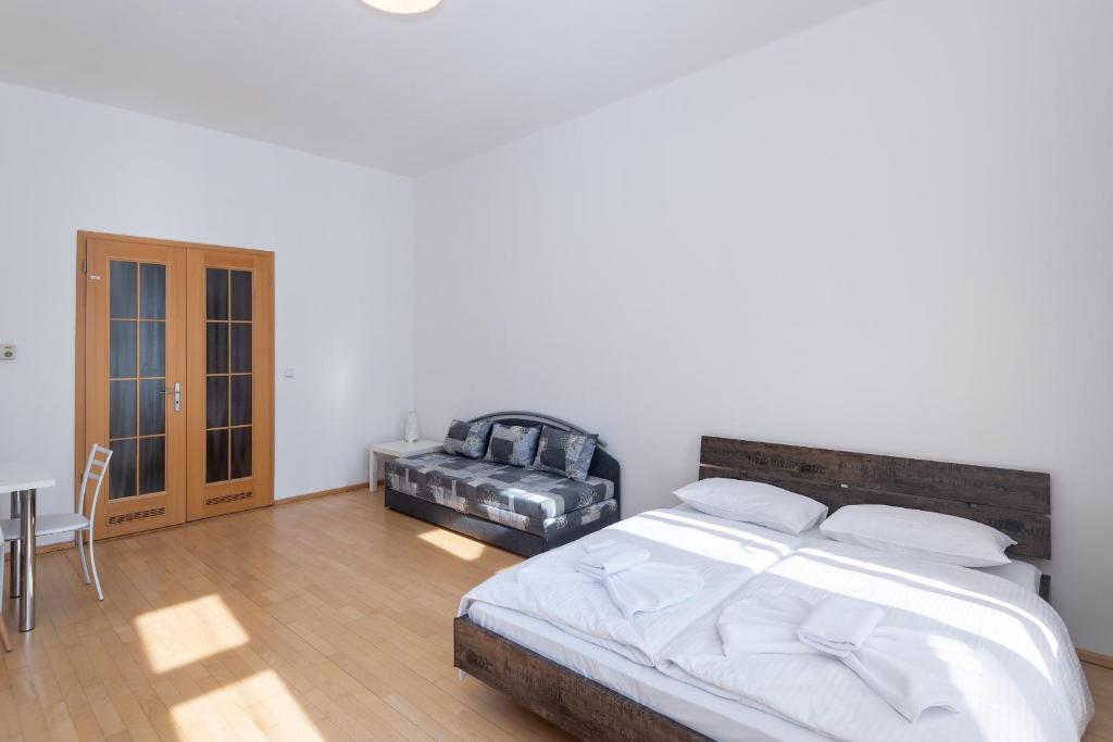 Postel nebo postele na pokoji v ubytování Apartment Štěpánská