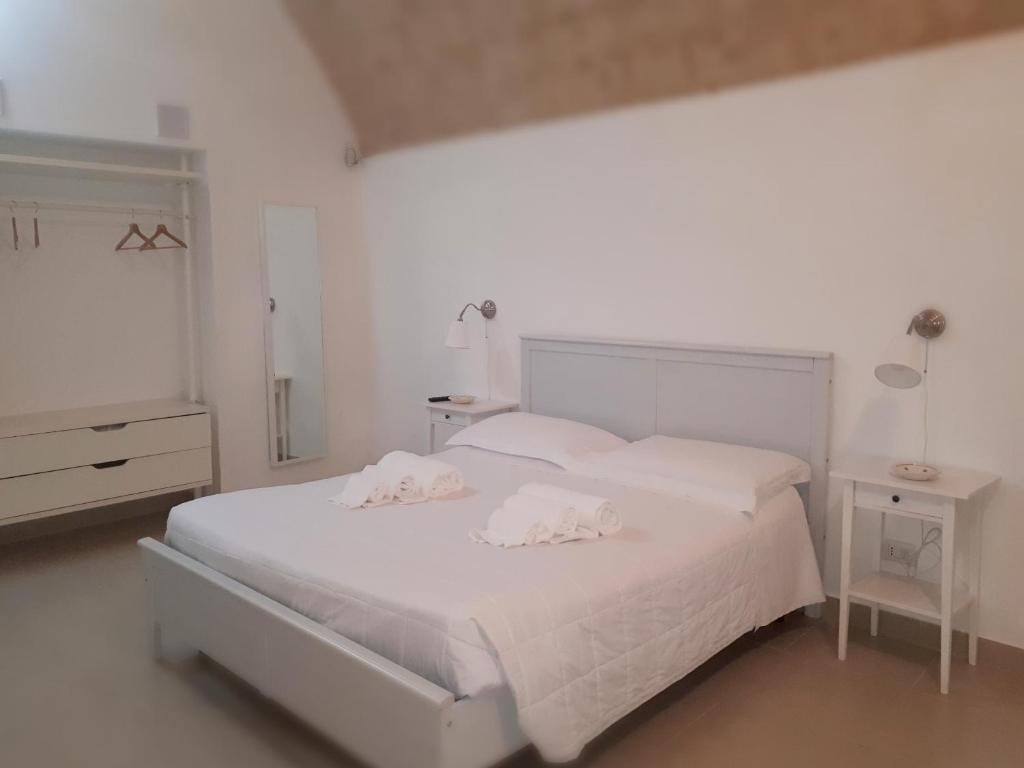 Postel nebo postele na pokoji v ubytování La Rosa dei Sassi 2