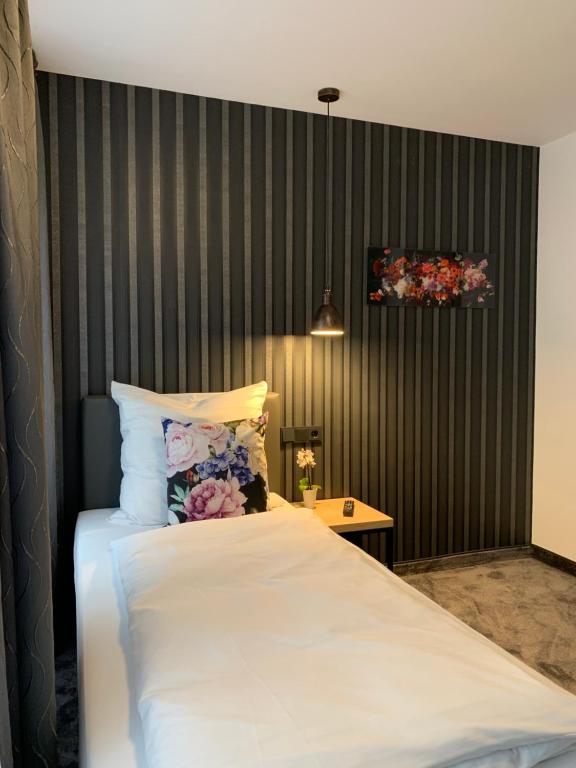 Postel nebo postele na pokoji v ubytování Hotel Dias