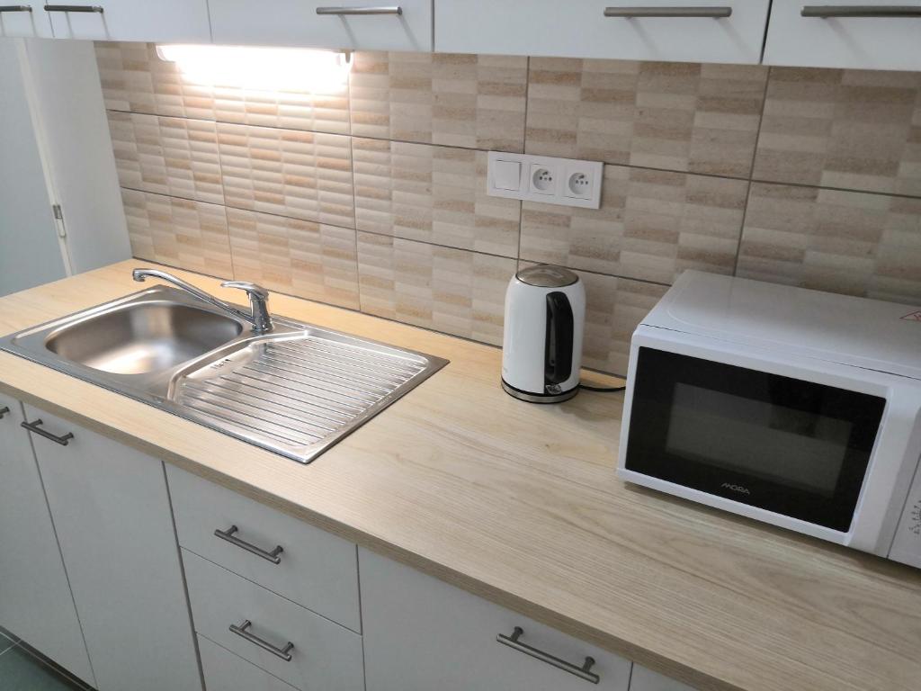 Kuchyň nebo kuchyňský kout v ubytování Hotel Marianeum
