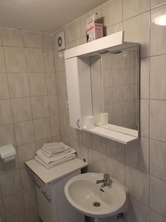 Łazienka w obiekcie Rooms & Apartment Hegic