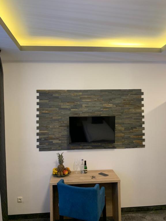 TV a/nebo společenská místnost v ubytování Hotel Dias