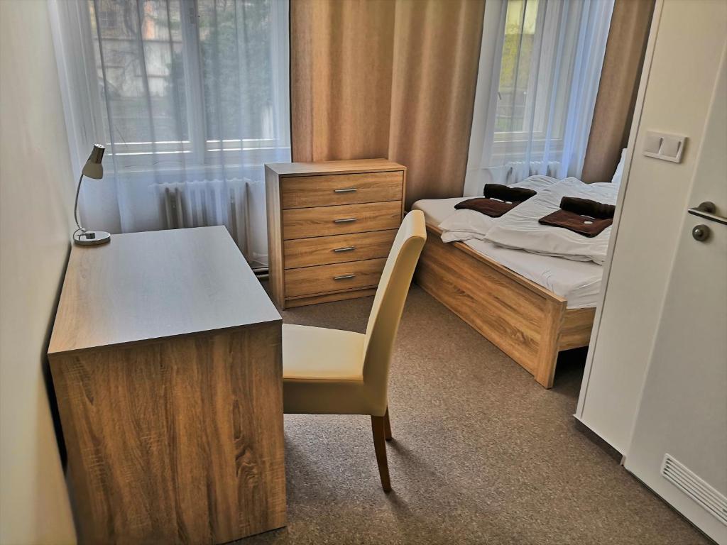 Postel nebo postele na pokoji v ubytování Hotel Marianeum