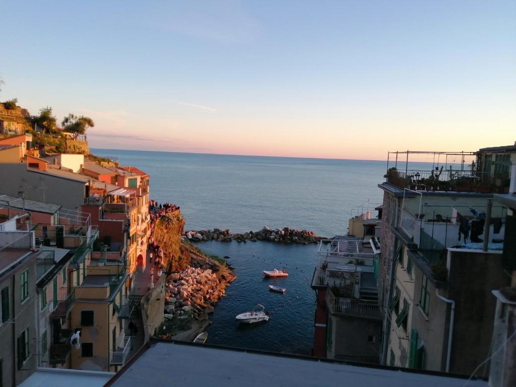 a view of a body of water between buildings at Meb in Riomaggiore