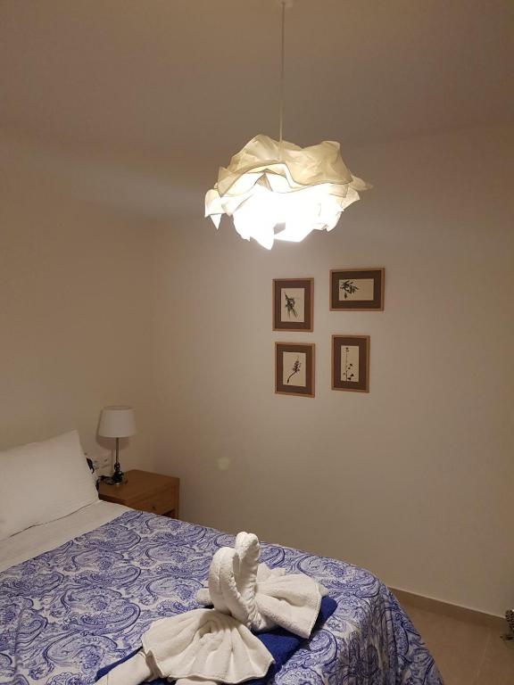 Łóżko lub łóżka w pokoju w obiekcie Natica Mare Villas