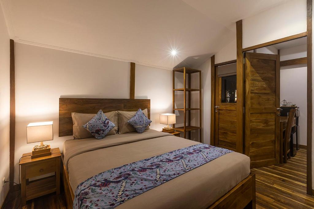 Łóżko lub łóżka w pokoju w obiekcie Orora Bungalows