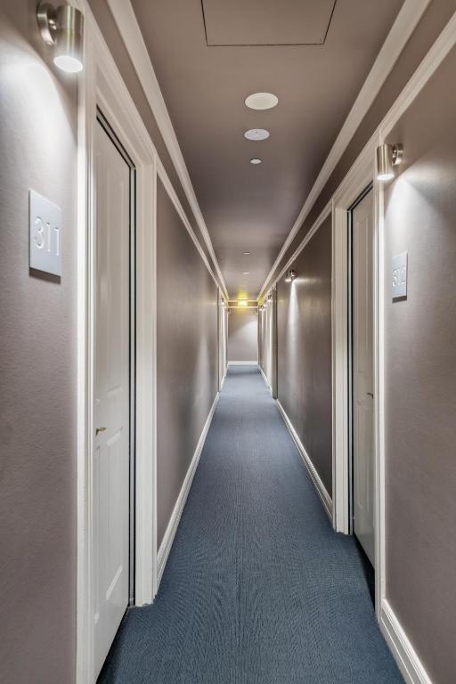 a corridor of an office building with a hallway at Best Western Melbourne City in Melbourne