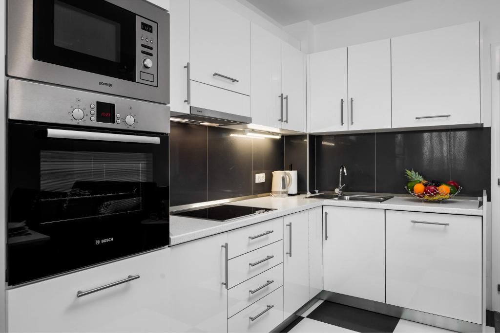 Kuchyňa alebo kuchynka v ubytovaní Lotus Apartman