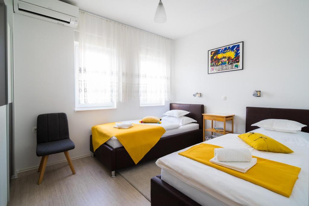 Posteľ alebo postele v izbe v ubytovaní Lotus Apartman