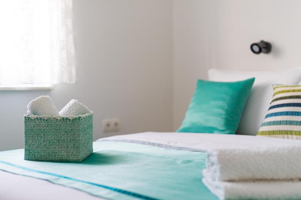 Posteľ alebo postele v izbe v ubytovaní Lotus Apartman