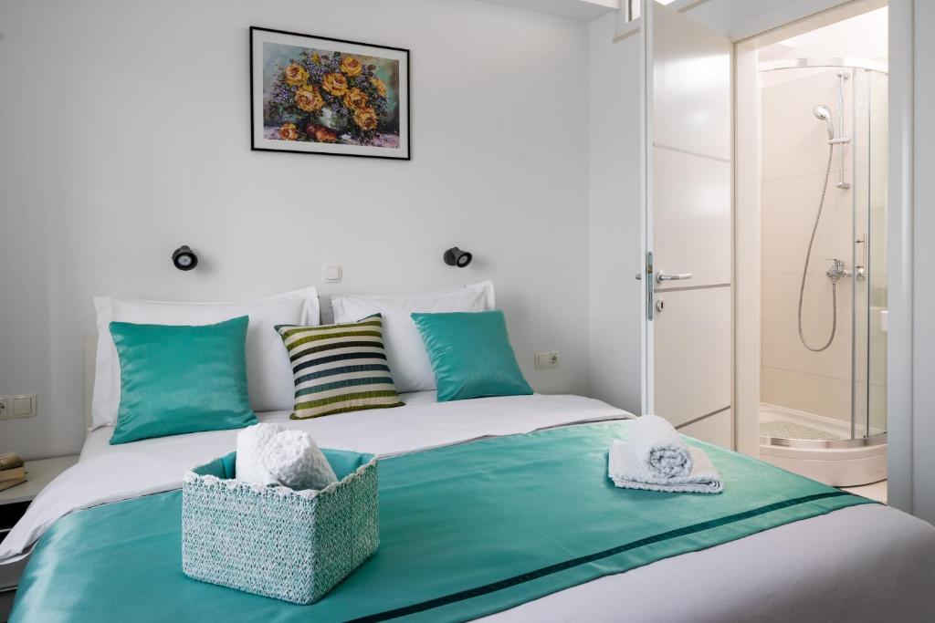 Posteľ alebo postele v izbe v ubytovaní Lotus Apartman
