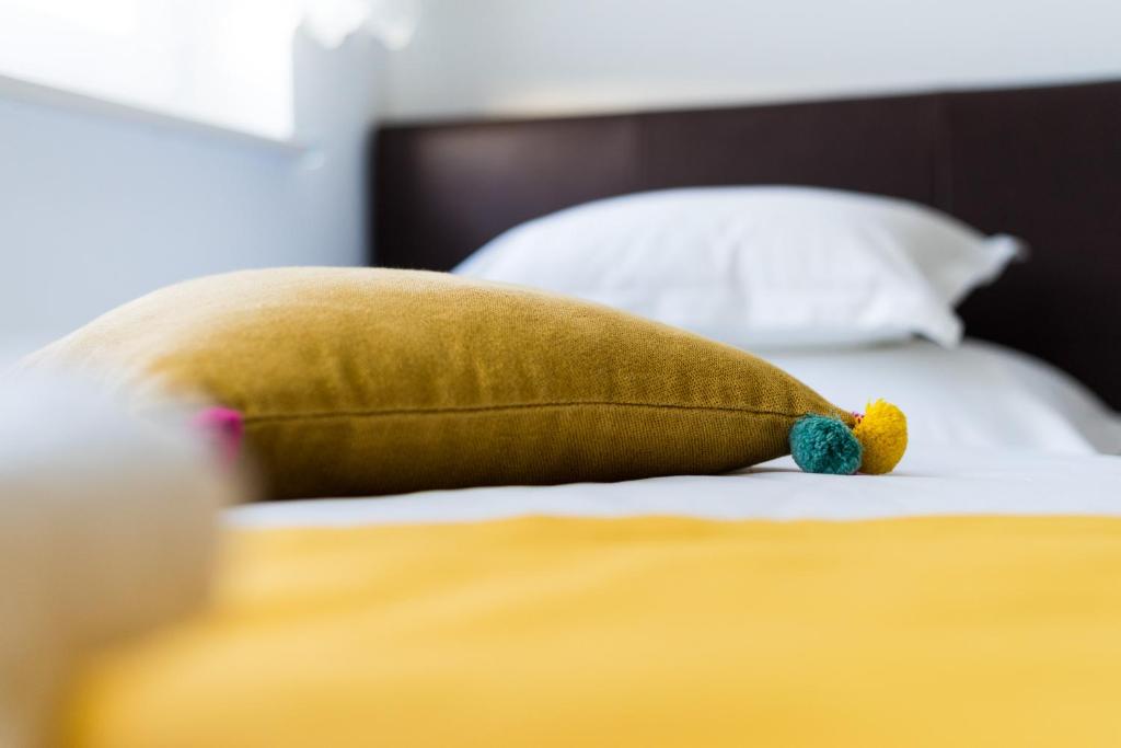 Posteľ alebo postele v izbe v ubytovaní Lotus Apartman