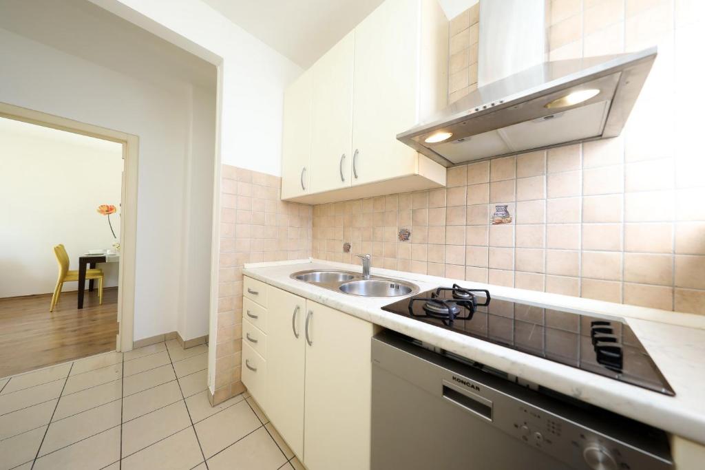 Kuchyňa alebo kuchynka v ubytovaní Apartment Sunny Side