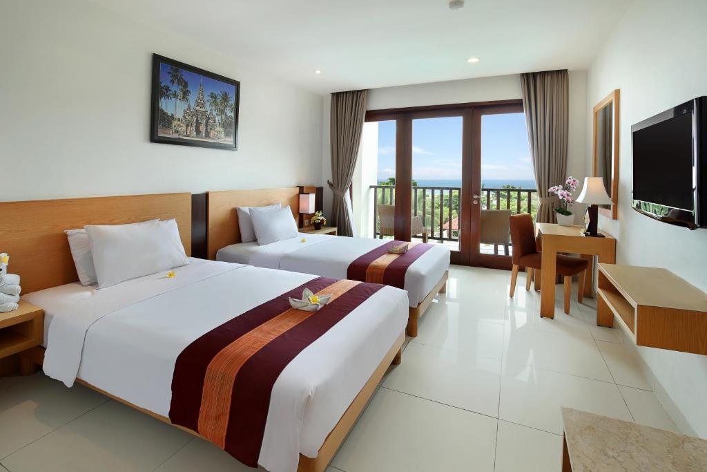 Postel nebo postele na pokoji v ubytování Bali Relaxing Resort and Spa
