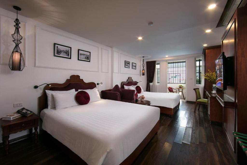 Postel nebo postele na pokoji v ubytování Hanoi Vision Premium Hotel