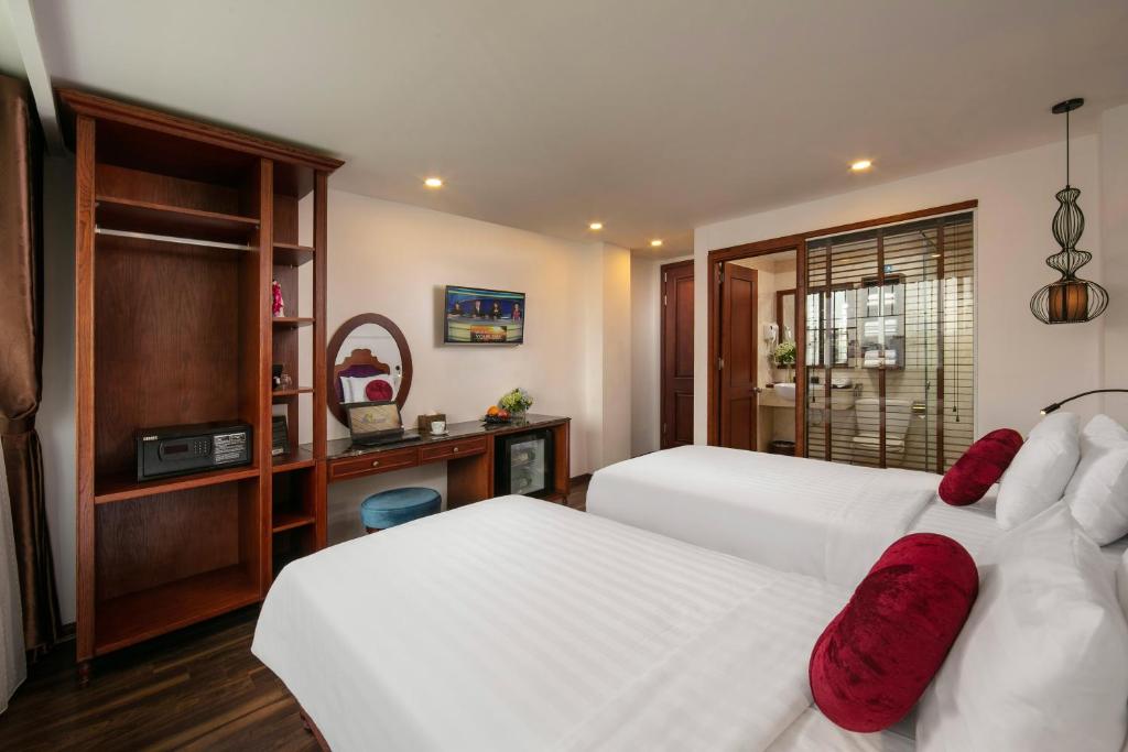Postel nebo postele na pokoji v ubytování Hanoi Vision Premium Hotel