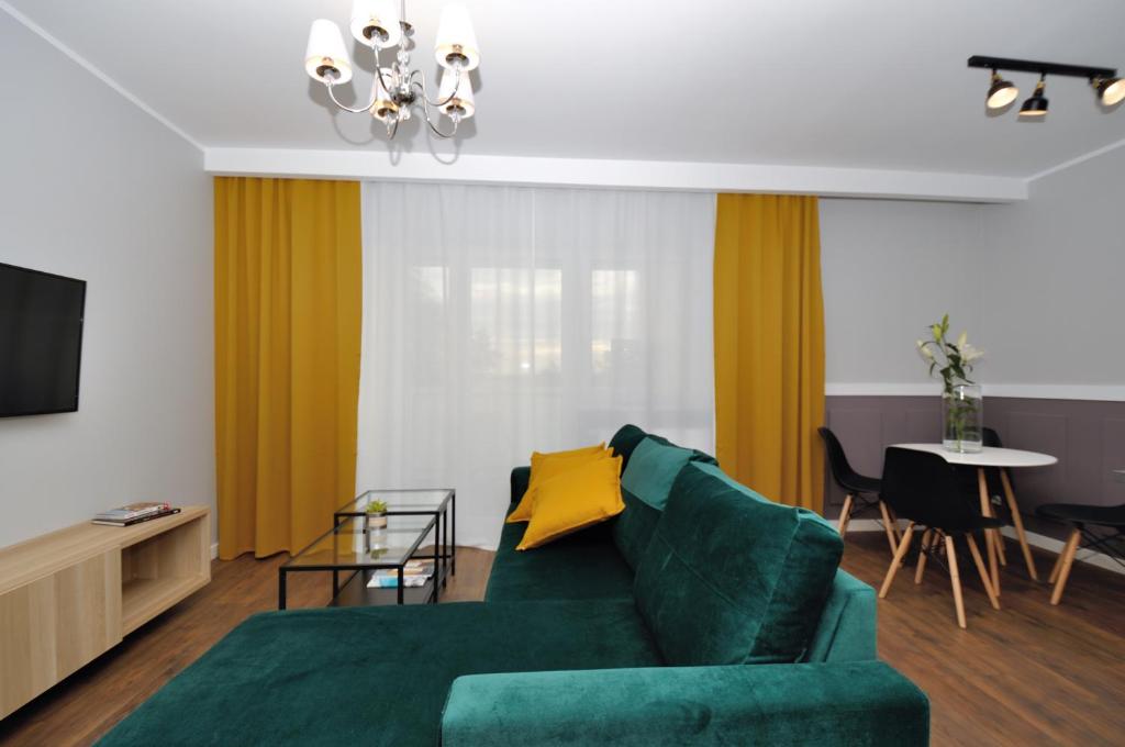 Posedenie v ubytovaní Apartament RESORT Chełmońskiego Śrem