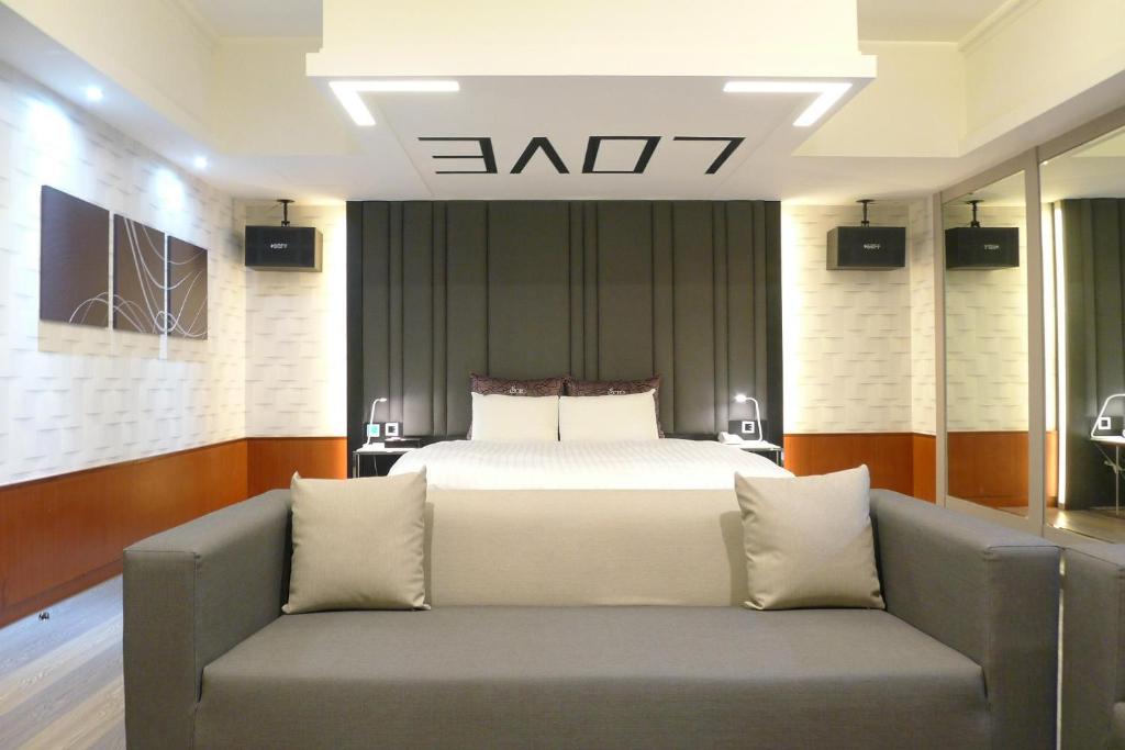 Postel nebo postele na pokoji v ubytování Soho Motel