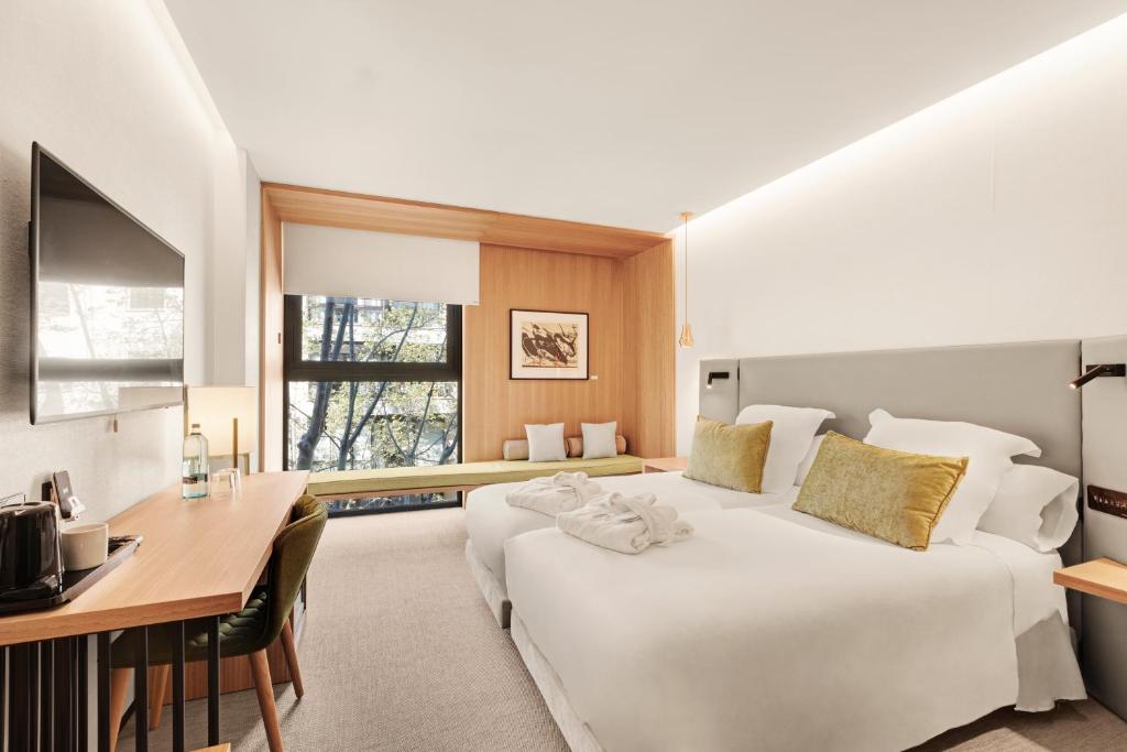 Postel nebo postele na pokoji v ubytování Protur Naisa Palma Hotel