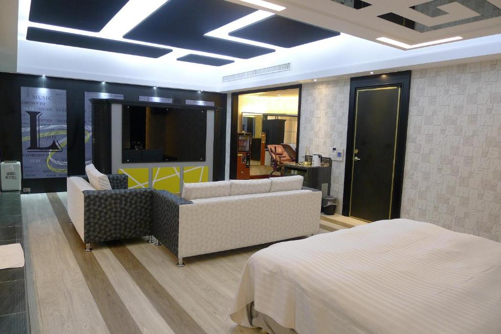 Postel nebo postele na pokoji v ubytování Soho Motel