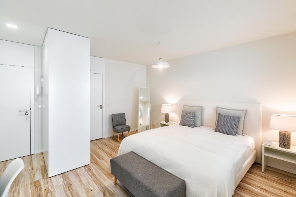 Postel nebo postele na pokoji v ubytování JR Studios & Suites I Rius I