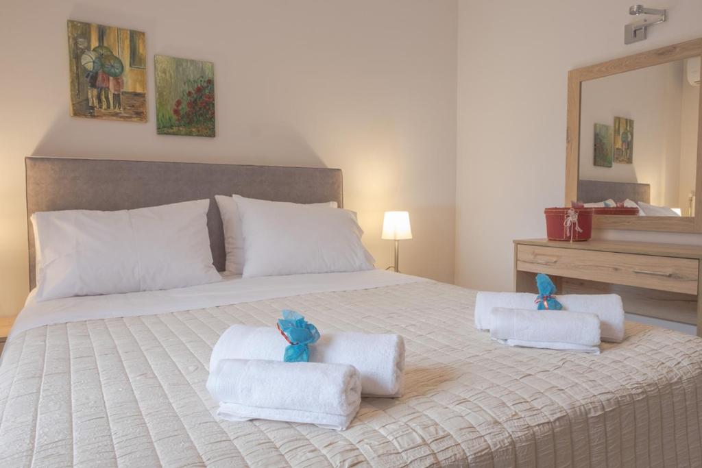 Łóżko lub łóżka w pokoju w obiekcie Katia Appartment