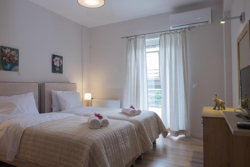Łóżko lub łóżka w pokoju w obiekcie Katia Appartment