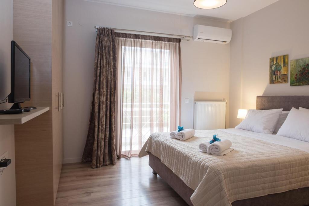 Łóżko lub łóżka w pokoju w obiekcie Katia Appartment