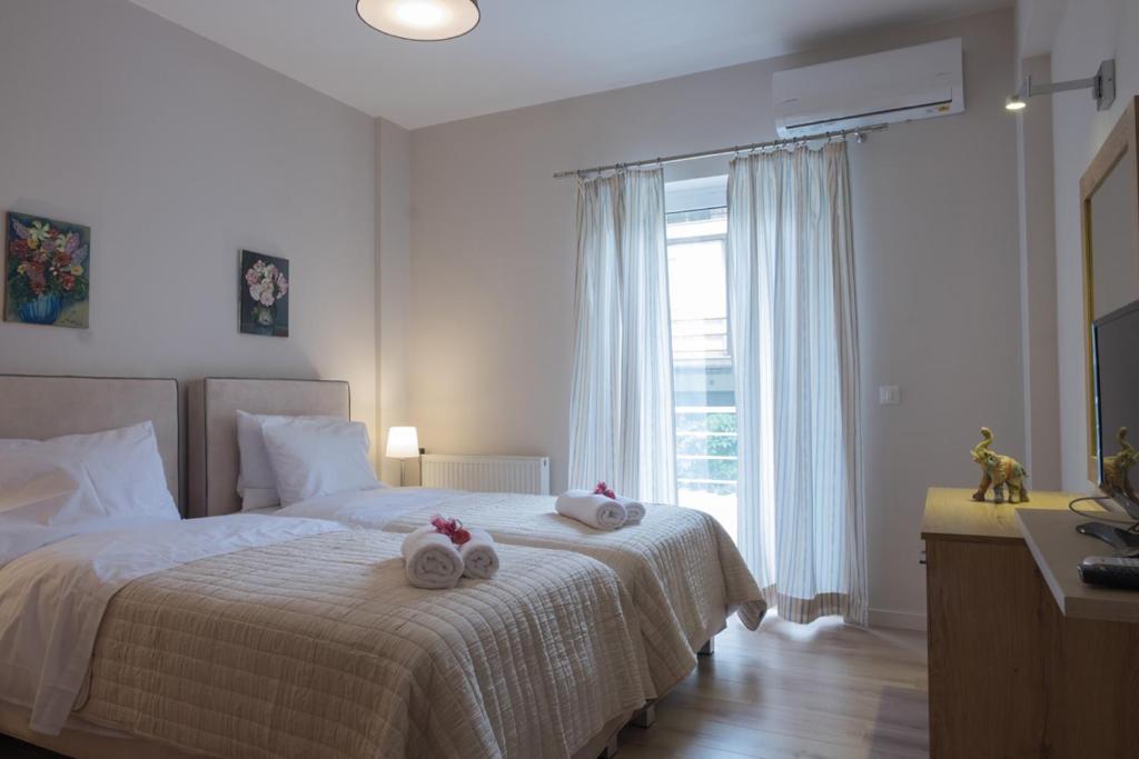 Łóżko lub łóżka w pokoju w obiekcie Katia Appartment