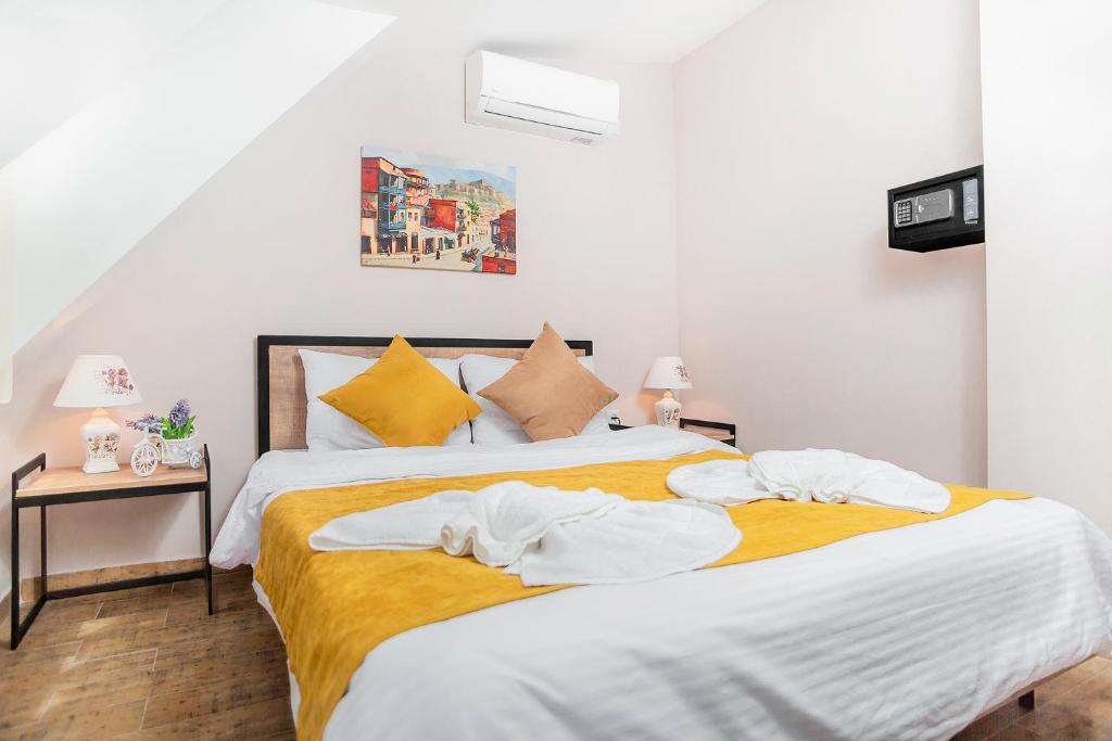 Postel nebo postele na pokoji v ubytování Diuma Hotel