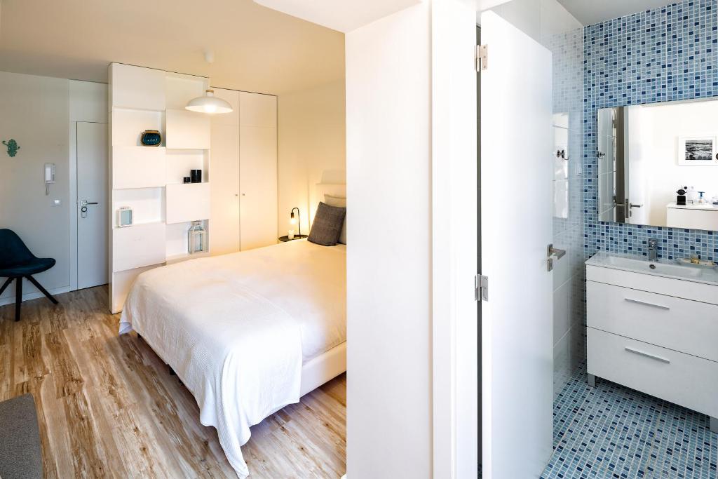 Postel nebo postele na pokoji v ubytování JR Studios & Suites I Rius I