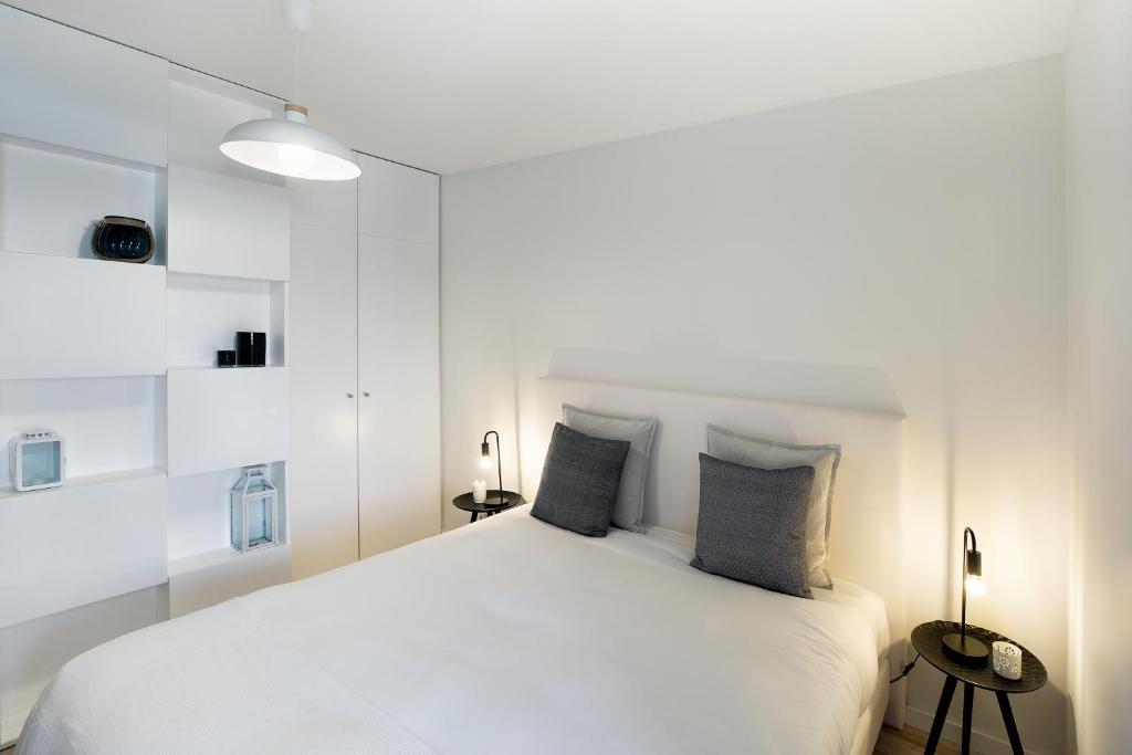 Postel nebo postele na pokoji v ubytování JR Studios & Suites I Rius I