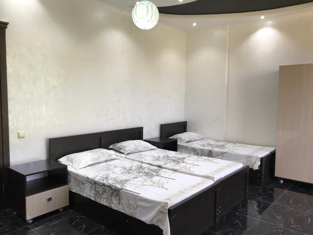 Postel nebo postele na pokoji v ubytování Guest House Kobuleti