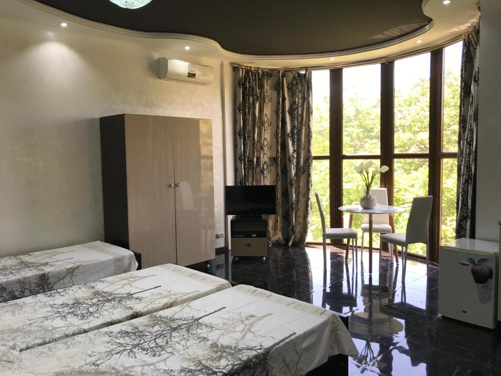 Postel nebo postele na pokoji v ubytování Guest House Kobuleti