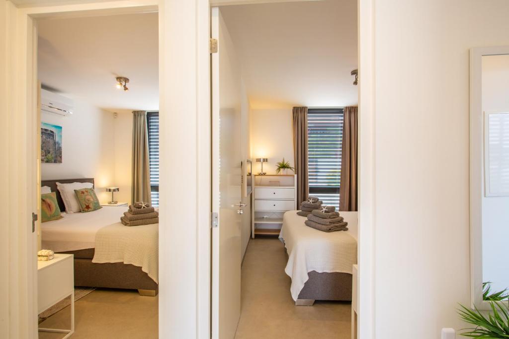 Postel nebo postele na pokoji v ubytování La Hasta Luxury Apartment Jan Thiel