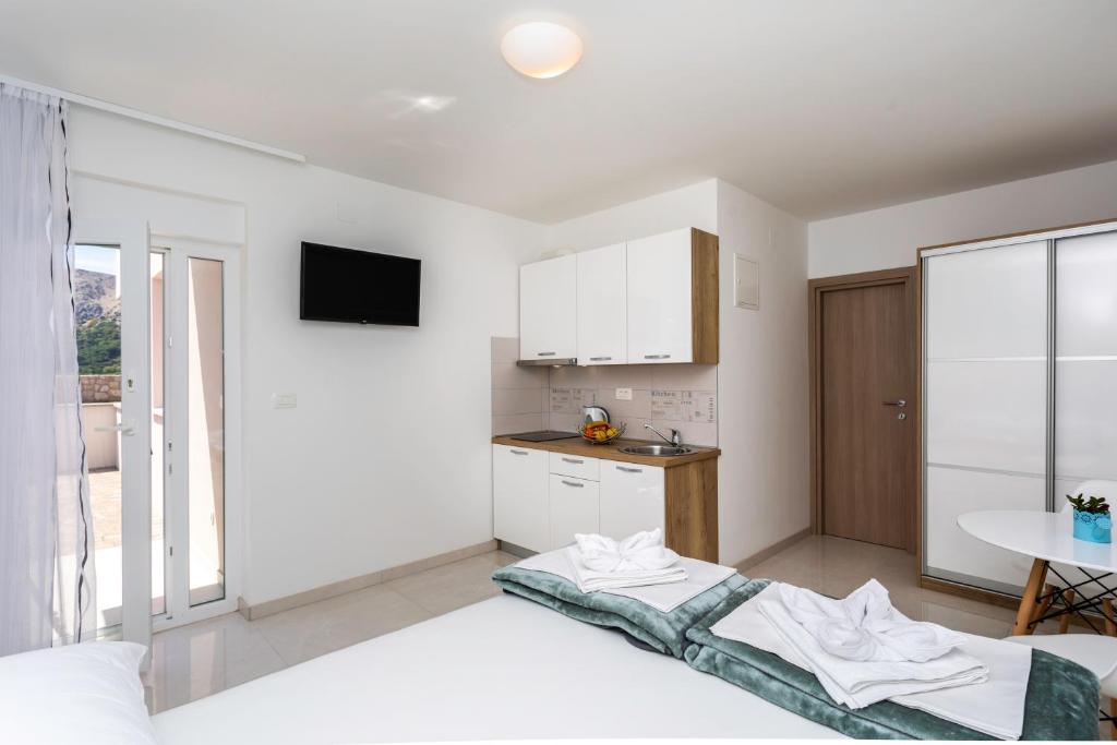 Posteľ alebo postele v izbe v ubytovaní Apartments Mateo 2